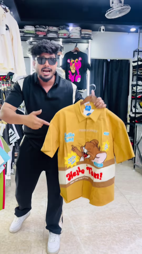 Bold Men's Graphic Print Polo Shirt with Cartoon Characters and Text - Image 4