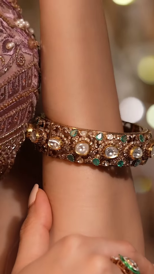Ornate Gold-Toned Bangle with Kundan, Emerald, and Pearl Detailing