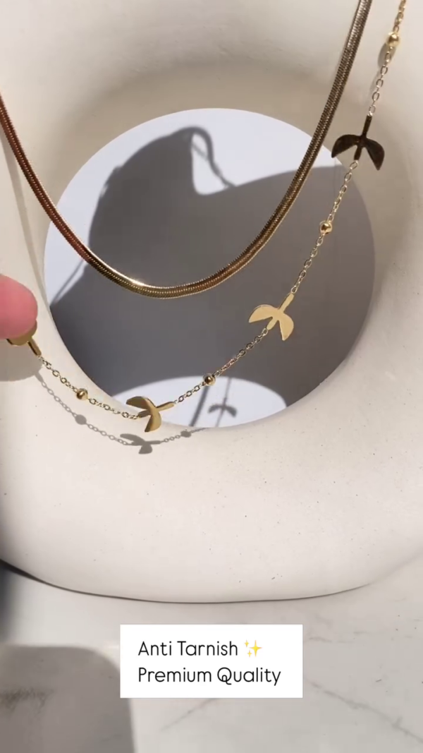 Delicate Layered Gold-Toned Necklace with Four-Leaf Clover and Pearl Pendants - Image 3