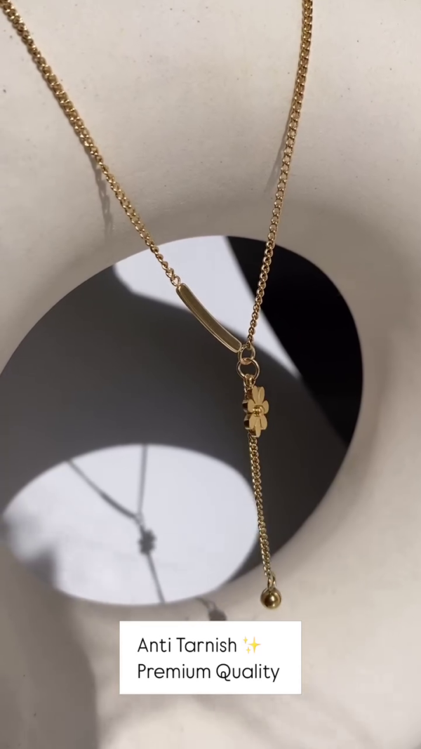 Delicate Layered Gold-Toned Necklace with Four-Leaf Clover and Pearl Pendants - Image 2