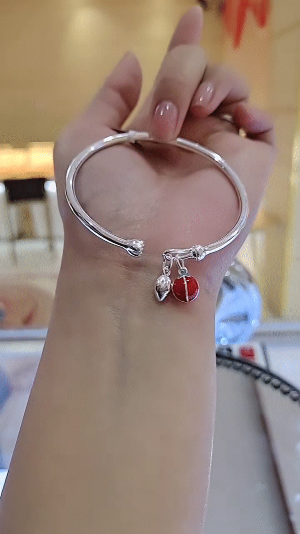 Charming Silver-Toned Bangle Bracelet with Enamel Ladybug and Leaf Charms - Image 2