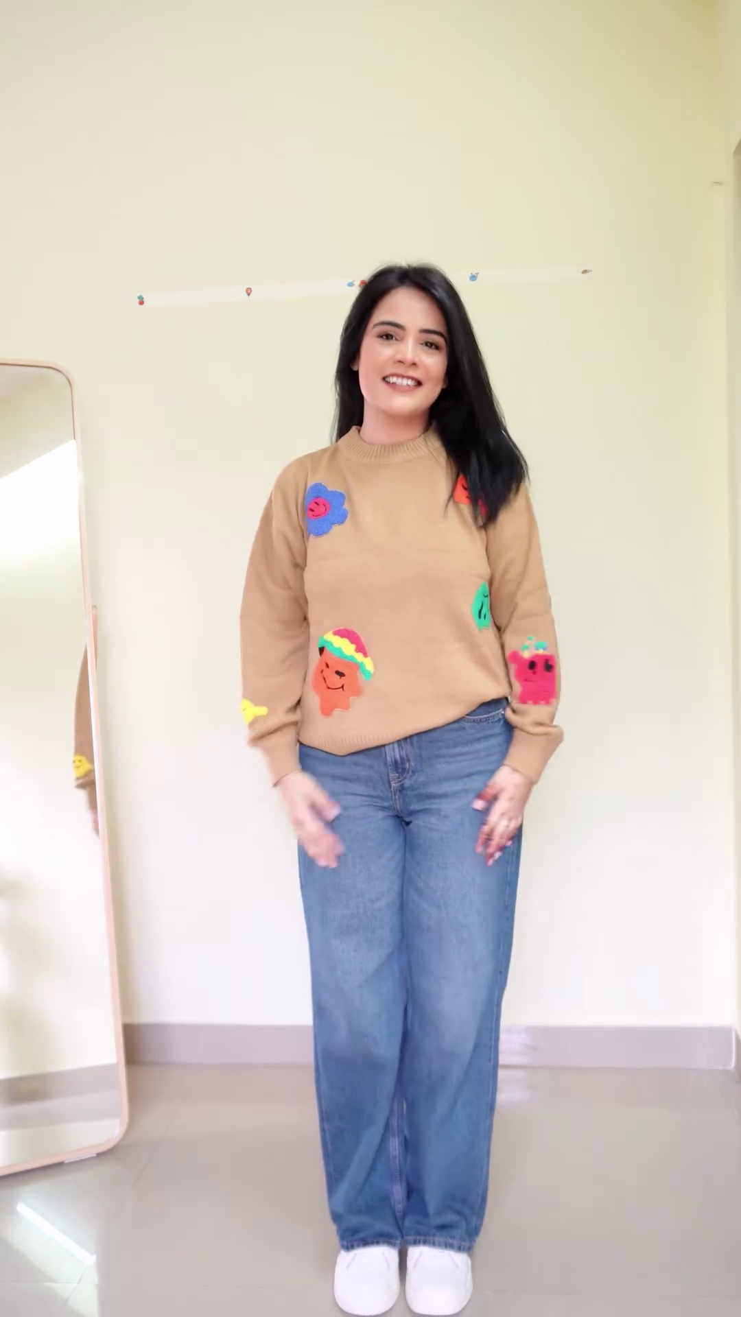 Soft White Fleece Pullover Sweatshirt with Multicolor 3D Bow Appliqué Embellishments and Relaxed Balloon Sleeves Paired with Classic Blue Wide-Leg Denim Jeans - Image 4