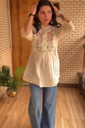 Embroidered Boho Style Peplum Top with Artistic Threadwork and Relaxed Comfort Fit